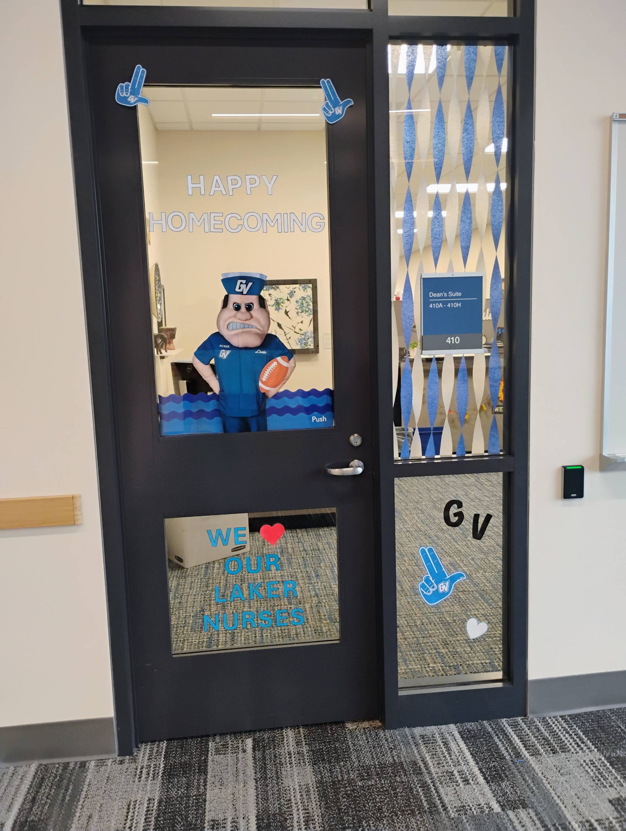 KCON Homecoming decorations, front door with Louie in scrubs cutout